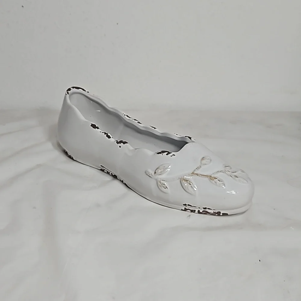 Decorative ceramic ballet shoe vase with vine design